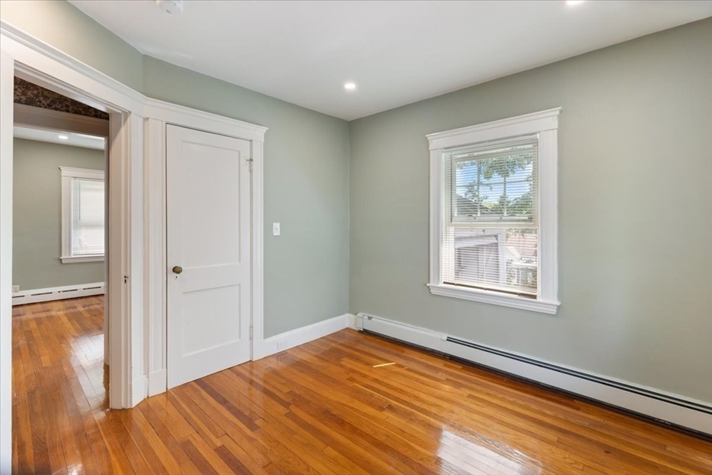 40 Riverview Street Dedham, MA 02026 - Photo 12 of 22 a view of an empty room with wooden floor and a window