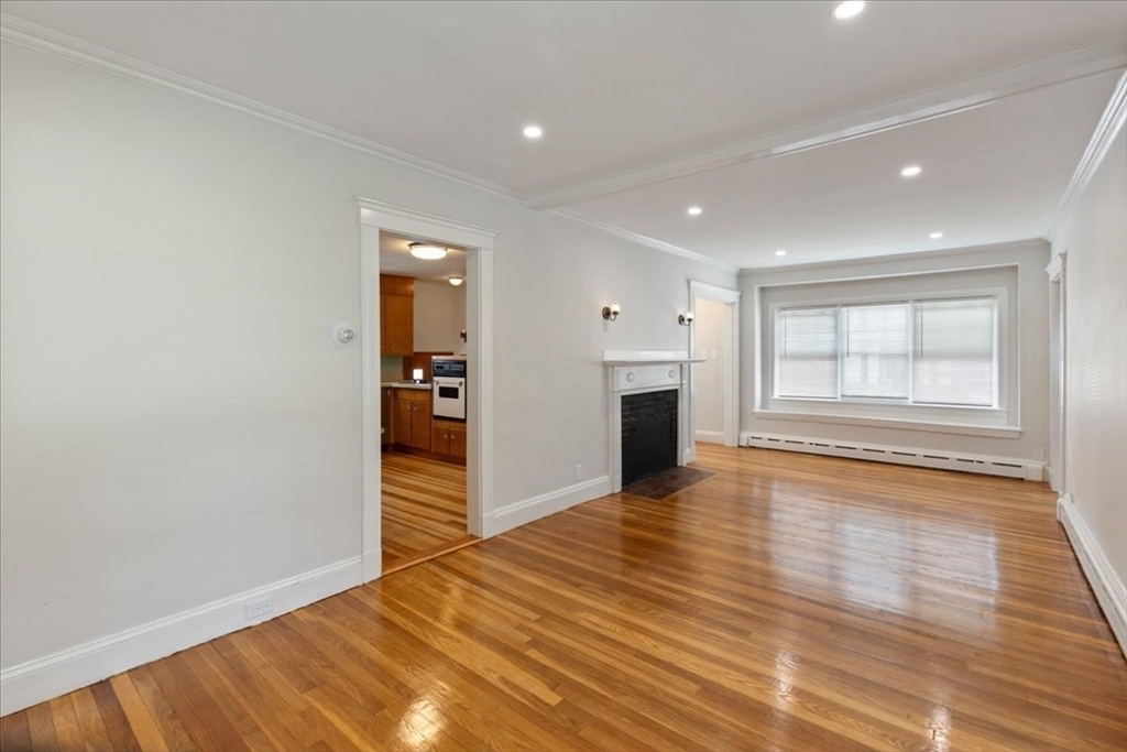 40 Riverview Street Dedham, MA 02026 - Photo 5 of 22 wooden floor in an empty room with a window