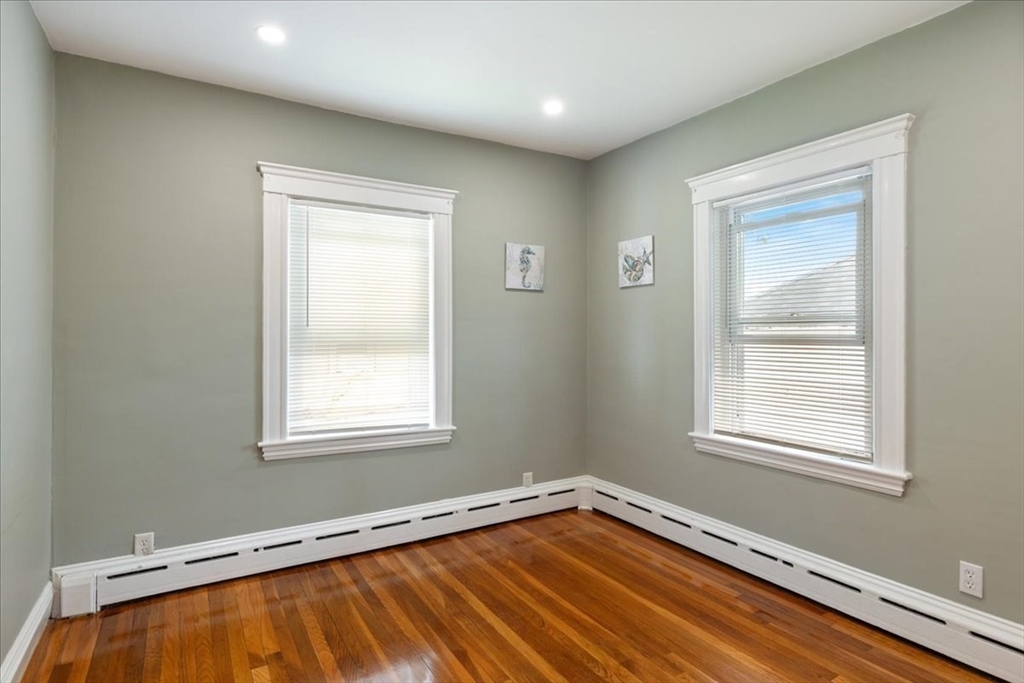 40 Riverview Street Dedham, MA 02026 - Photo 9 of 22 a view of an empty room with a window and wooden floor