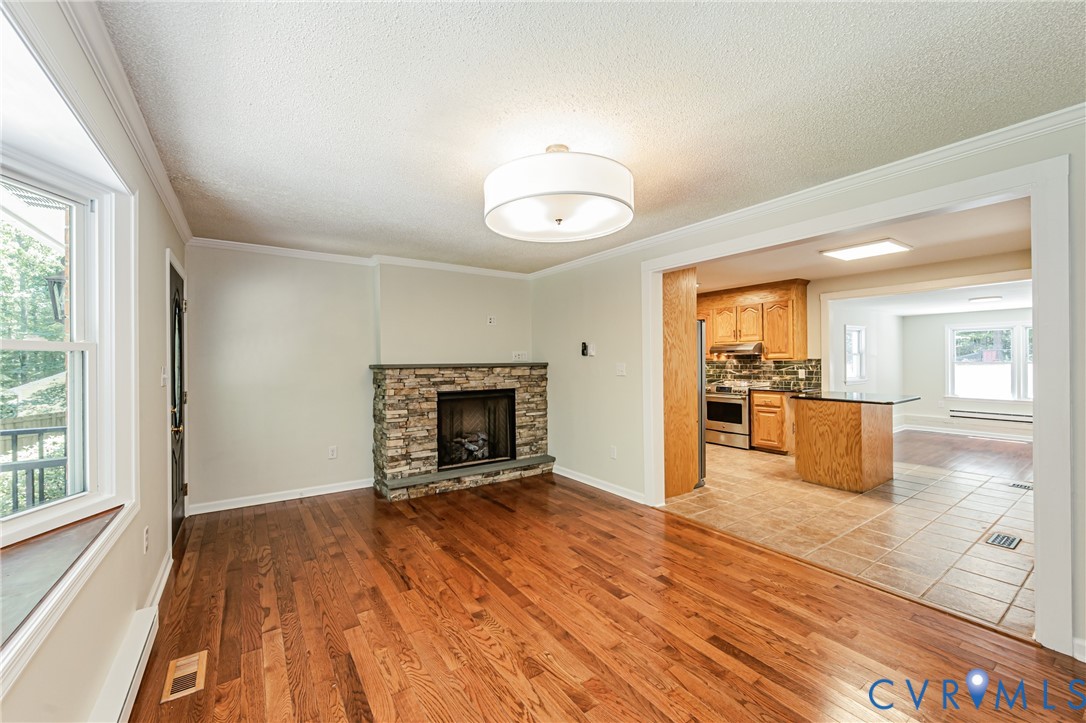 16110 Rowlett Road Chesterfield, VA 23838 - Photo 11 of 23 Living area featuring wood flooring, a gas firepla