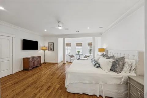 a spacious bedroom with a bed and a large window