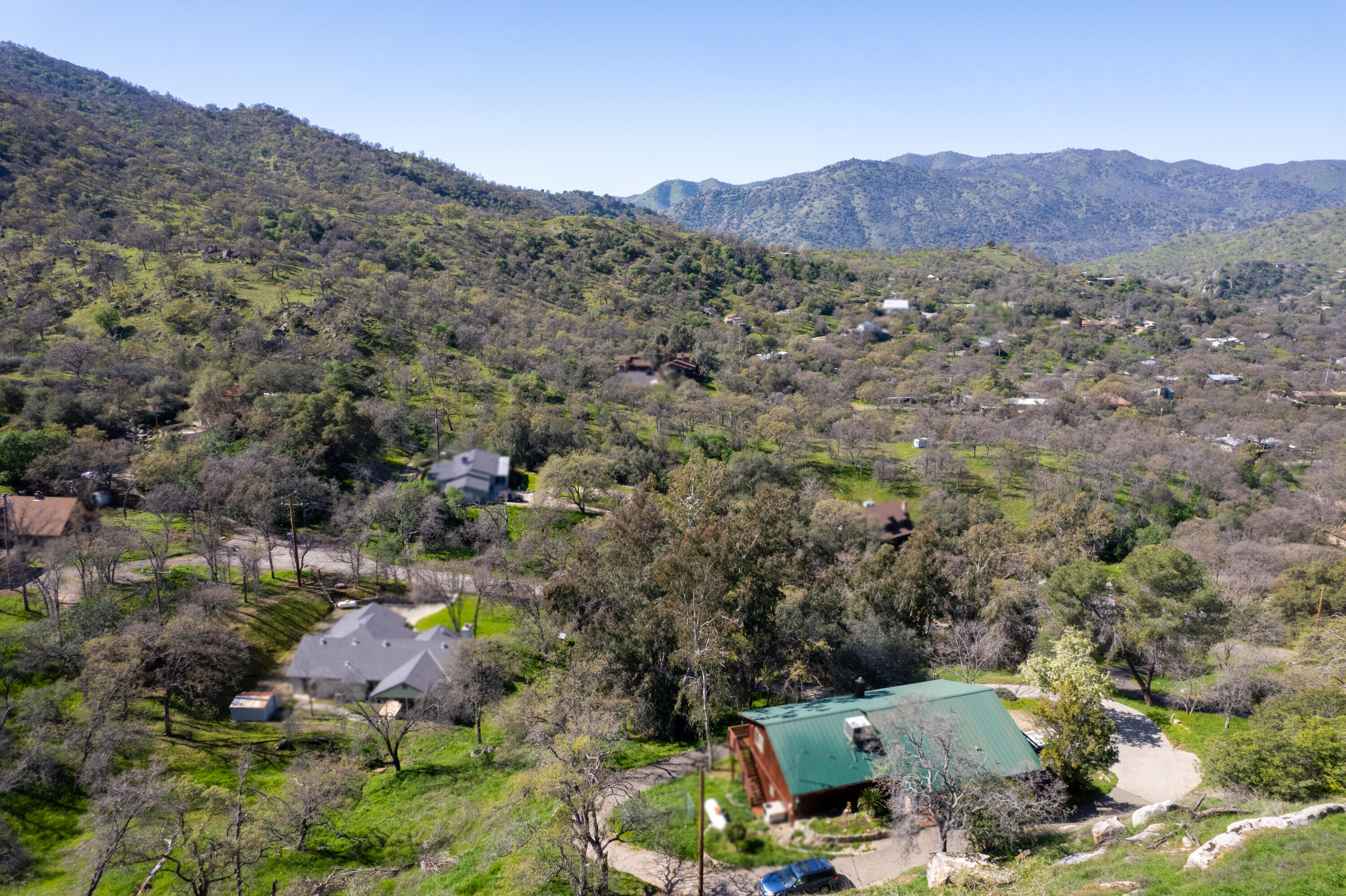44040 Skyline Drive Three Rivers, CA 93271 - Photo 37 of 40 an aerial view of a houses with a lush green hillside