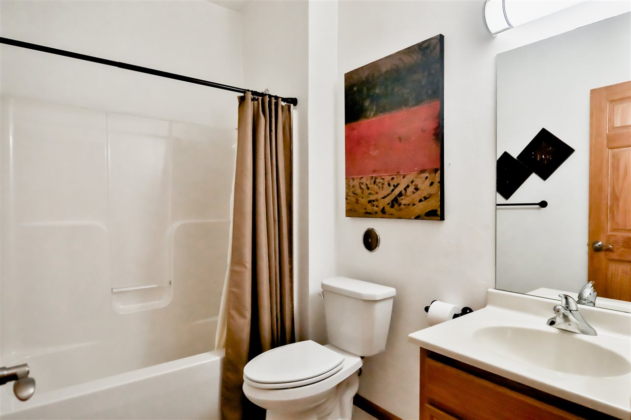 10135 Monarch Road, Unit 3 Roscoe, IL 61073 - Photo 18 of 20 a bathroom with a sink and a mirror