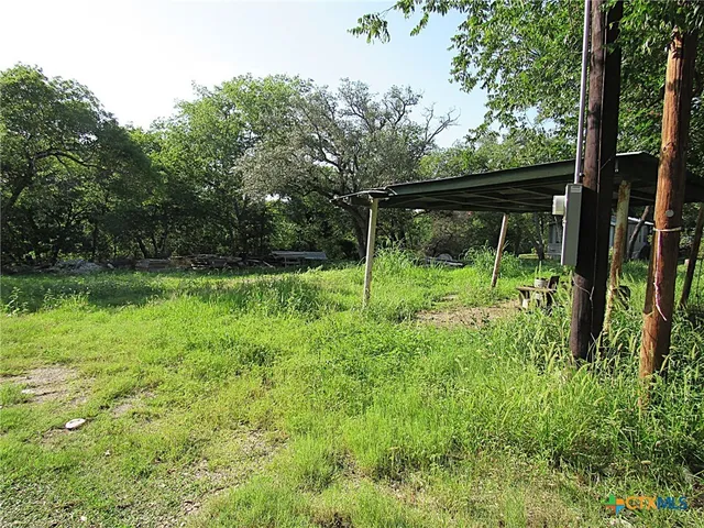 a view of outdoor space with deck and yard