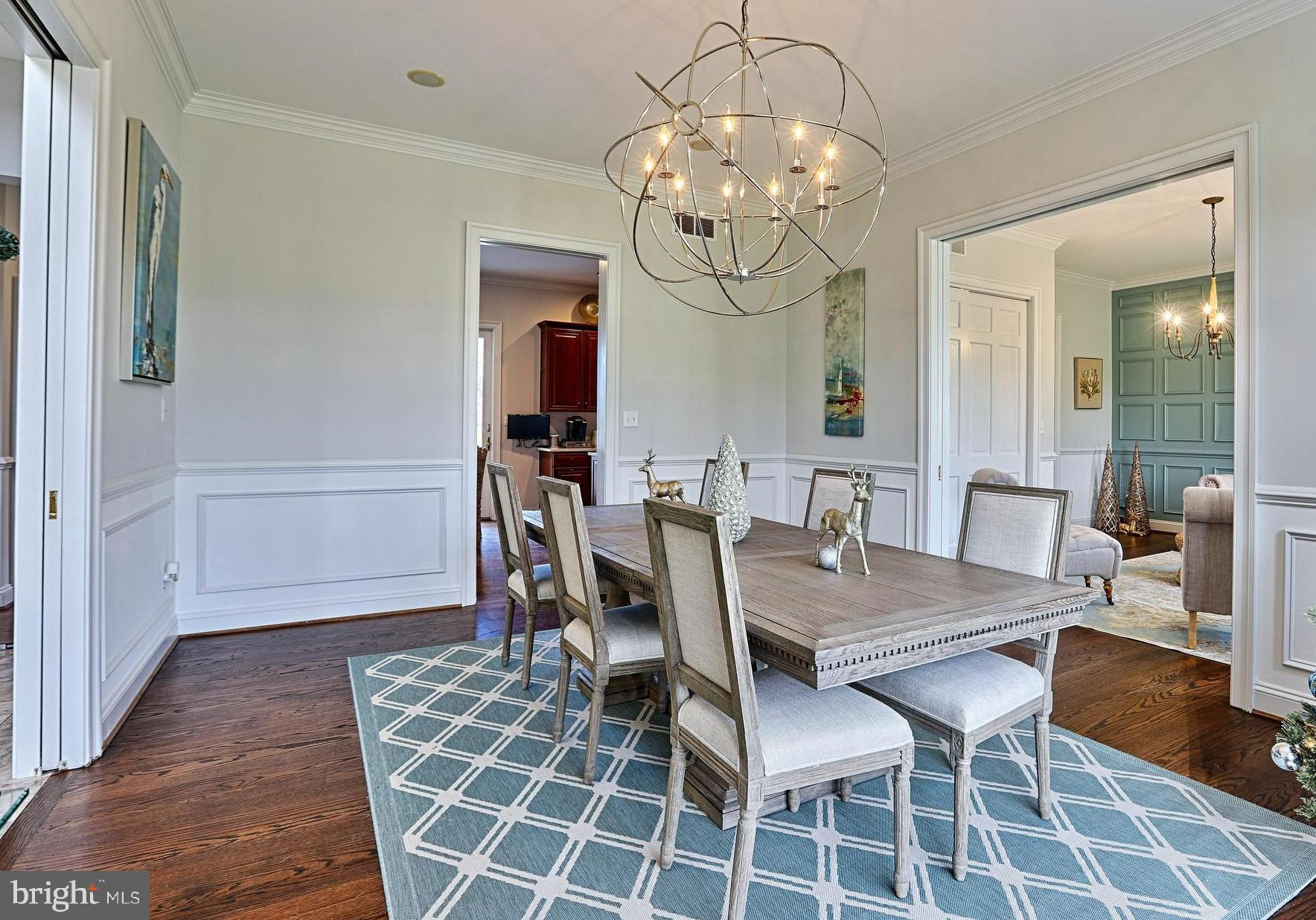 2902 Cox Neck Road East Chester, MD 21619 - Photo 5 of 57 a view of a dining room with furniture and chandelier
