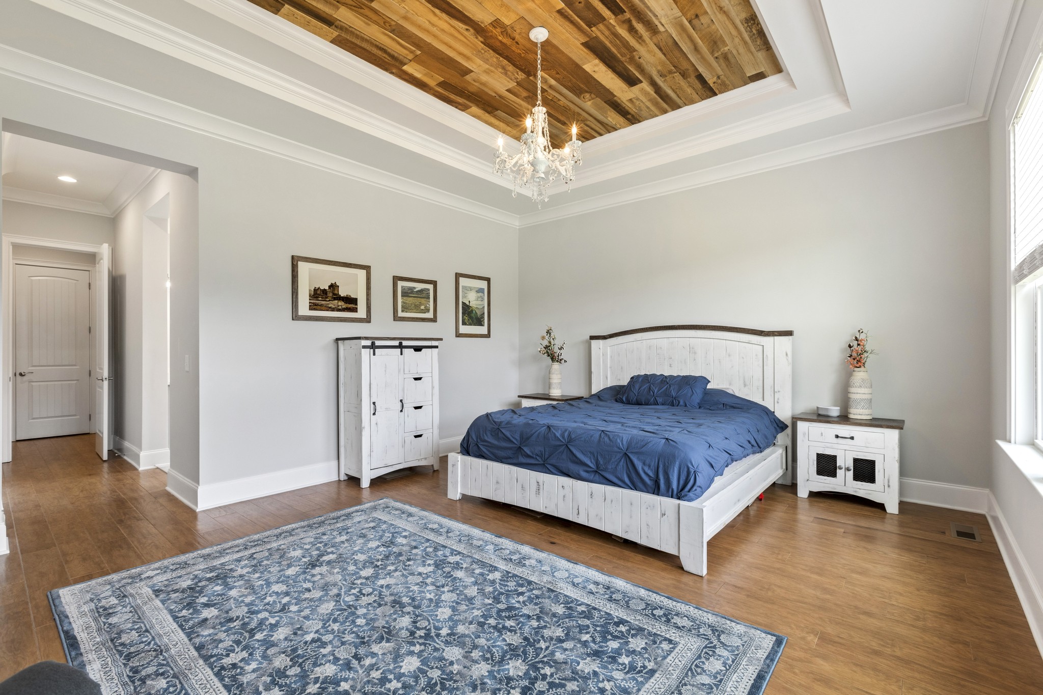 7952 Daugherty-Capley Road Primm Springs, TN 38476 - Photo 17 of 44 a bedroom with a bed rug and wooden floor