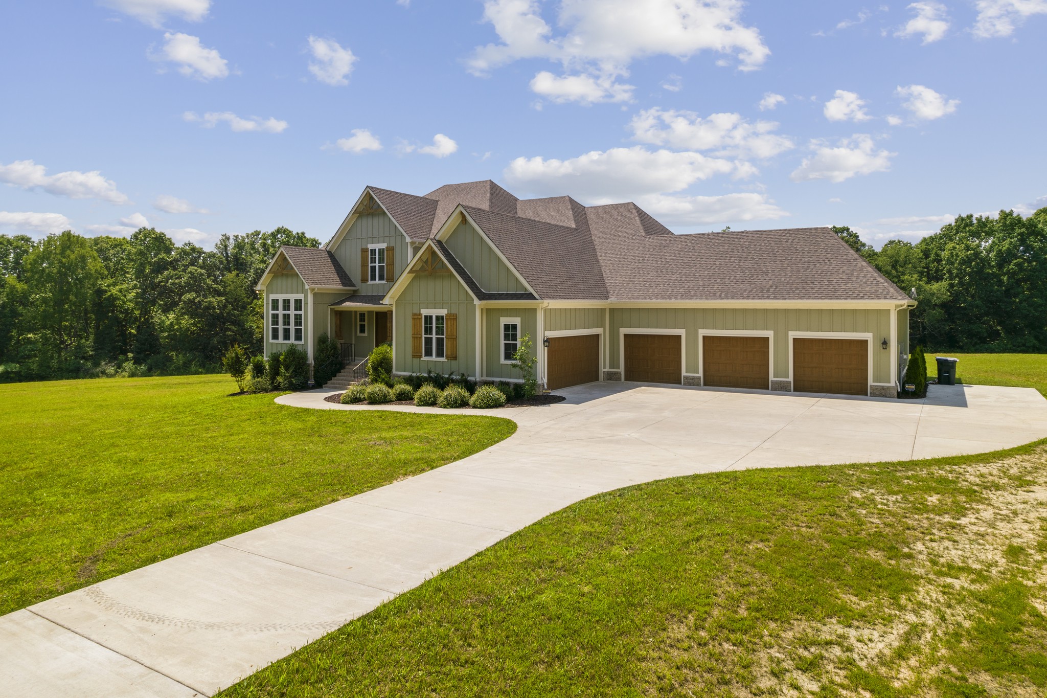 7952 Daugherty-Capley Road Primm Springs, TN 38476 - Photo 3 of 44 a front view of a house with garden
