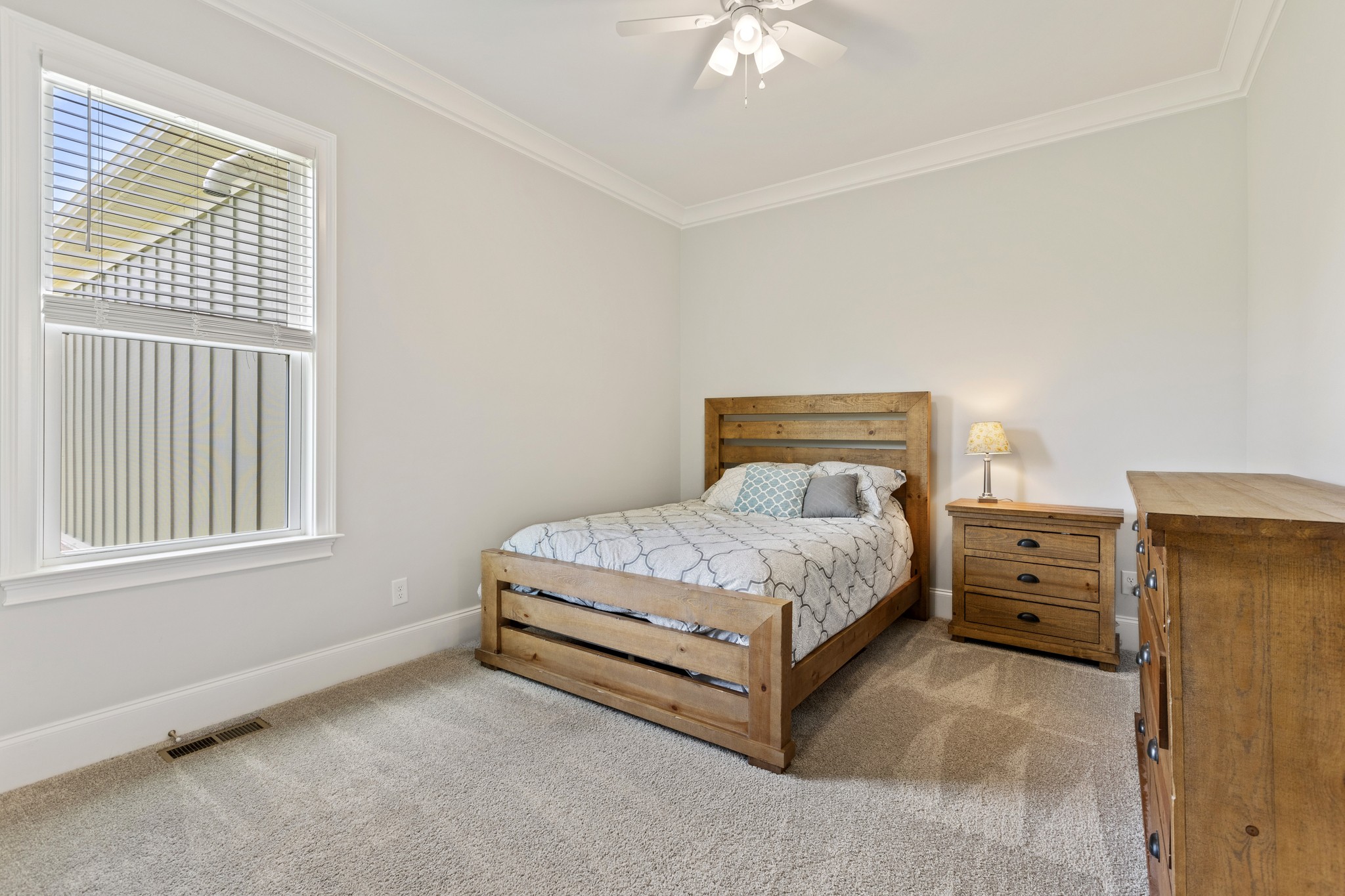 7952 Daugherty-Capley Road Primm Springs, TN 38476 - Photo 21 of 44 a bedroom with a bed and a window