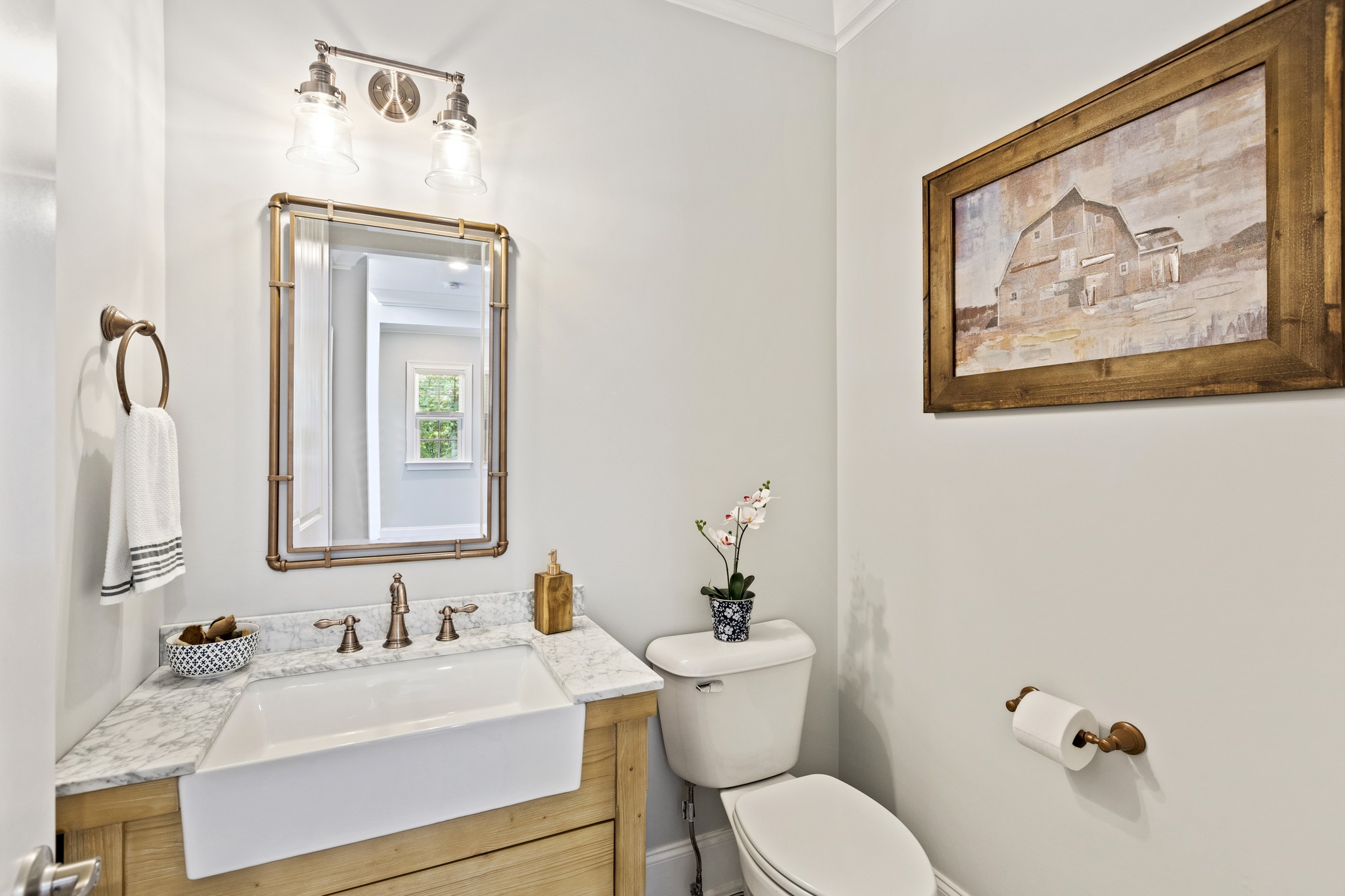 7952 Daugherty-Capley Road Primm Springs, TN 38476 - Photo 24 of 44 a bathroom with a toilet sink and mirror