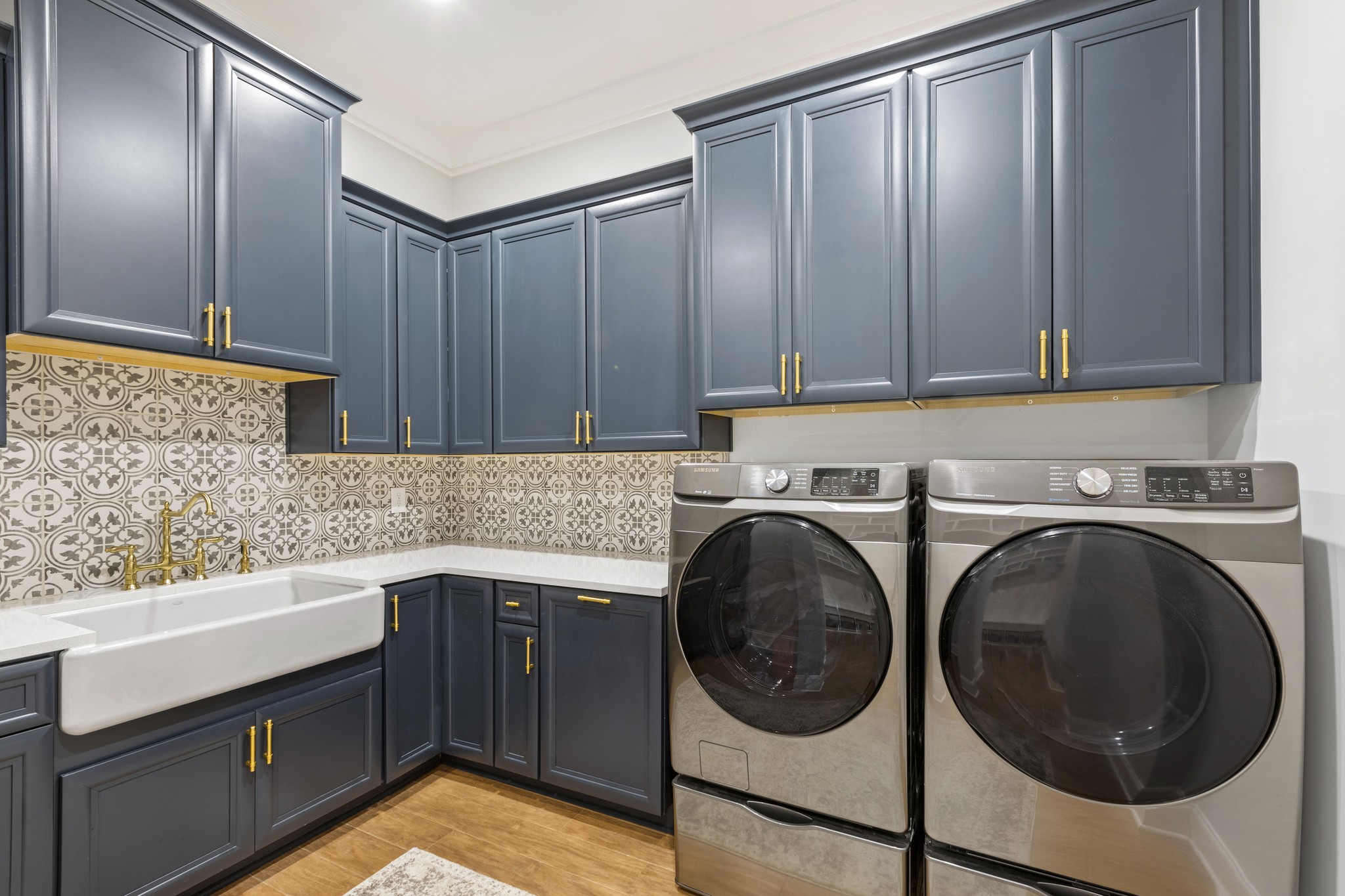7952 Daugherty-Capley Road Primm Springs, TN 38476 - Photo 25 of 44 a kitchen with a sink a washer and dryer
