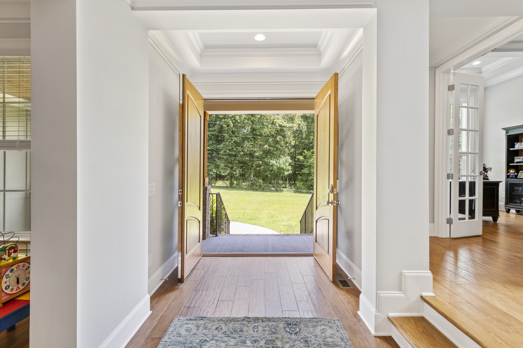 7952 Daugherty-Capley Road Primm Springs, TN 38476 - Photo 7 of 44 a view of hallway with wooden floor and a rug