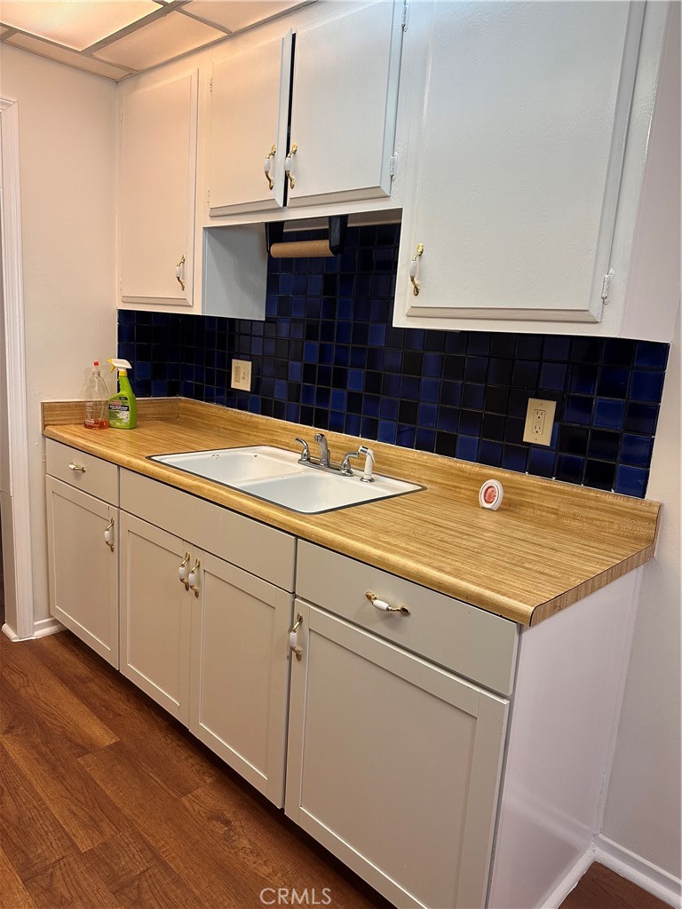 1350 West Lambert Road, Unit 120 La Habra, CA 90631 - Photo 12 of 22 a kitchen with a sink and cabinets
