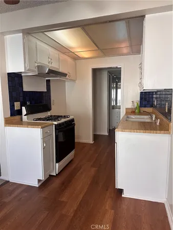 a kitchen with a stove and a microwave