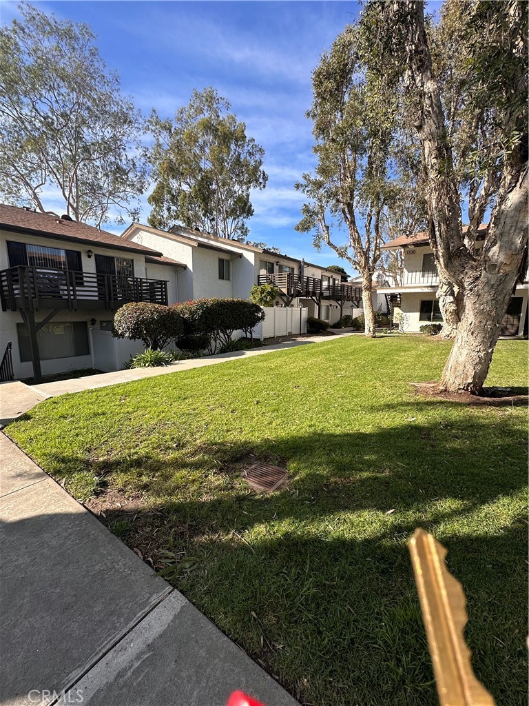1350 West Lambert Road, Unit 120 La Habra, CA 90631 - Photo 19 of 22 a view of a house with a yard