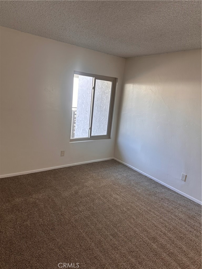 1350 West Lambert Road, Unit 120 La Habra, CA 90631 - Photo 7 of 22 an empty room with a window