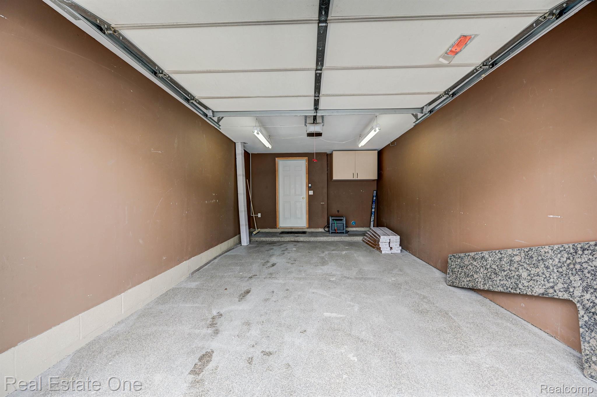 3578 Oakmonte Boulevard, Unit 96 Rochester, MI 48306 - Photo 39 of 47 Epoxy Floor - Cabinets for storage