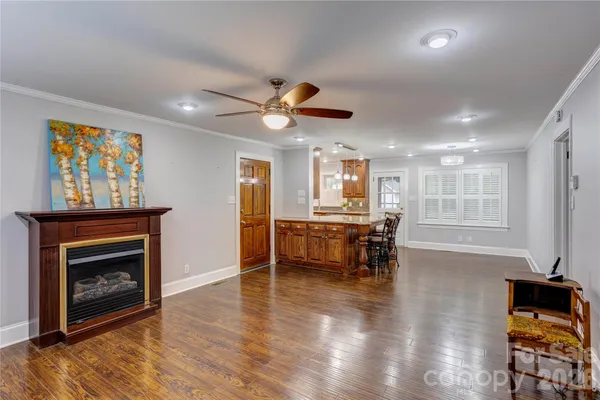 a view of a room with furniture and a fireplace