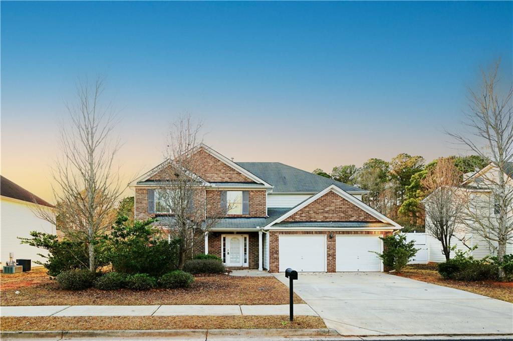 301 Othello Drive Hampton, GA 30228 - Photo 1 of 1 a front view of a house with a garden