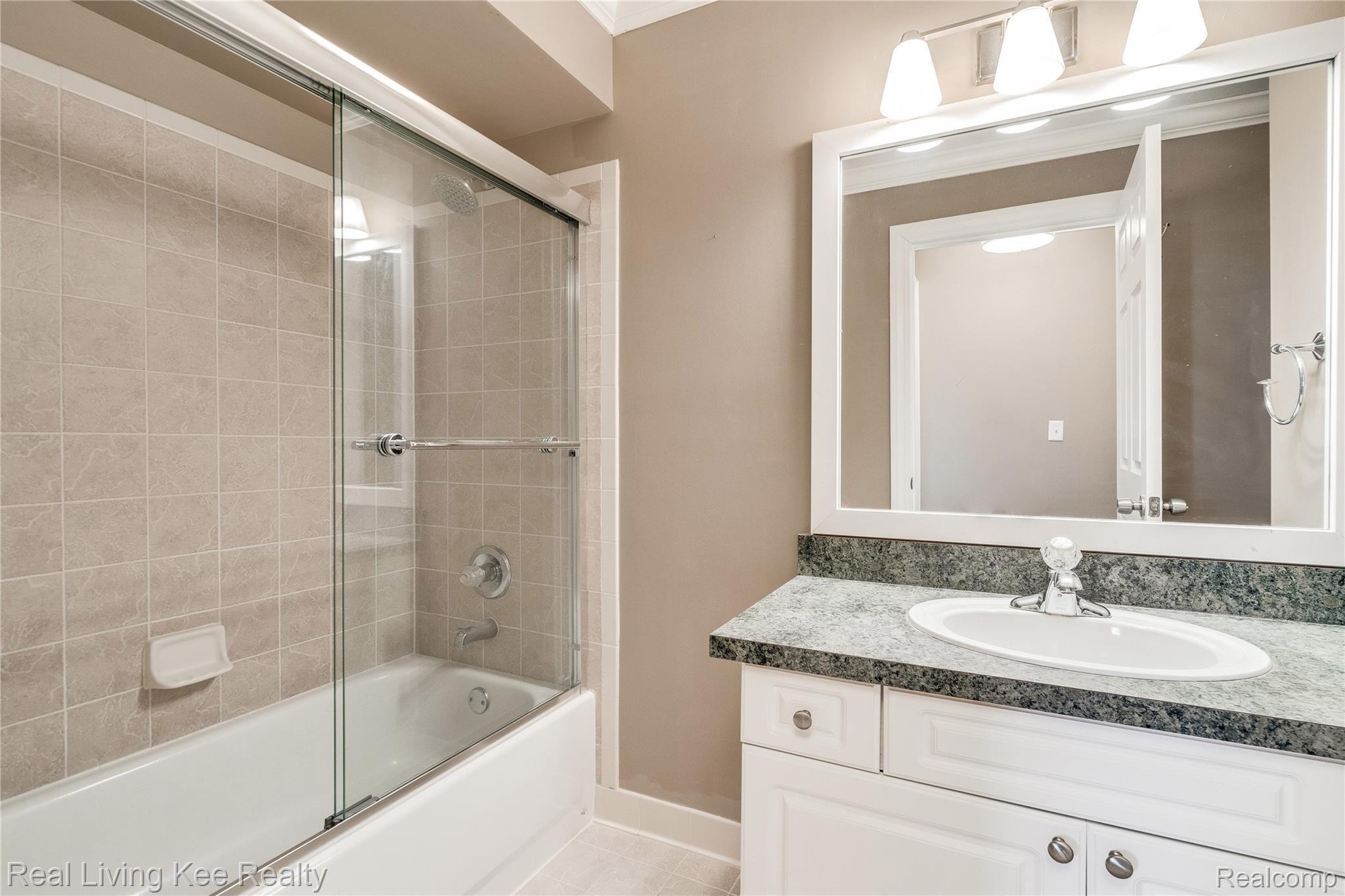 3601 Tremonte Circle Rochester, MI 48306 - Photo 36 of 44 Yep, a tub and shower doors here as well.
