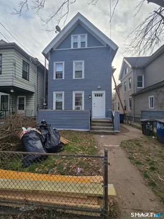 a bedroom with a bed and a fireplace