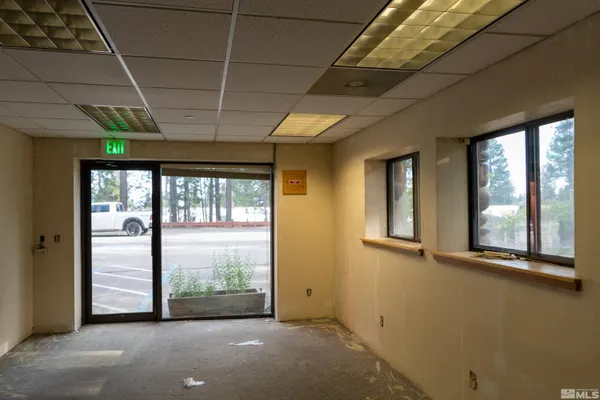a view of a room with large windows