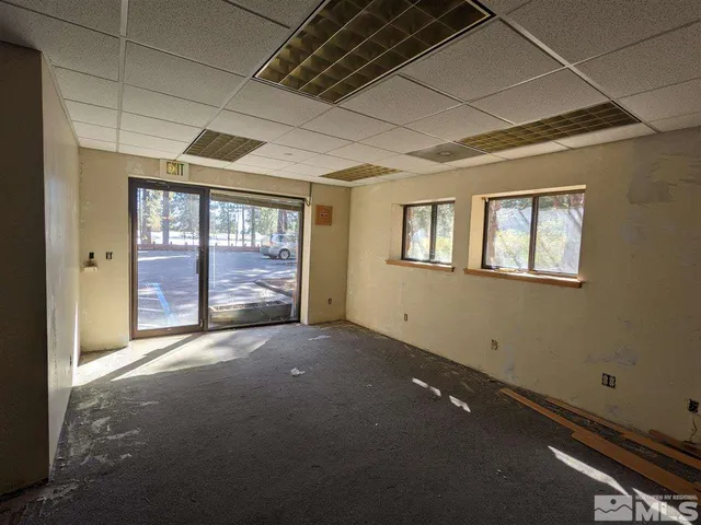 a view of an empty room with a window
