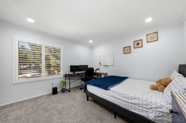 a bathroom with a double vanity sink toilet mirror and shower