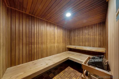 a patio with a table and chairs under an umbrella