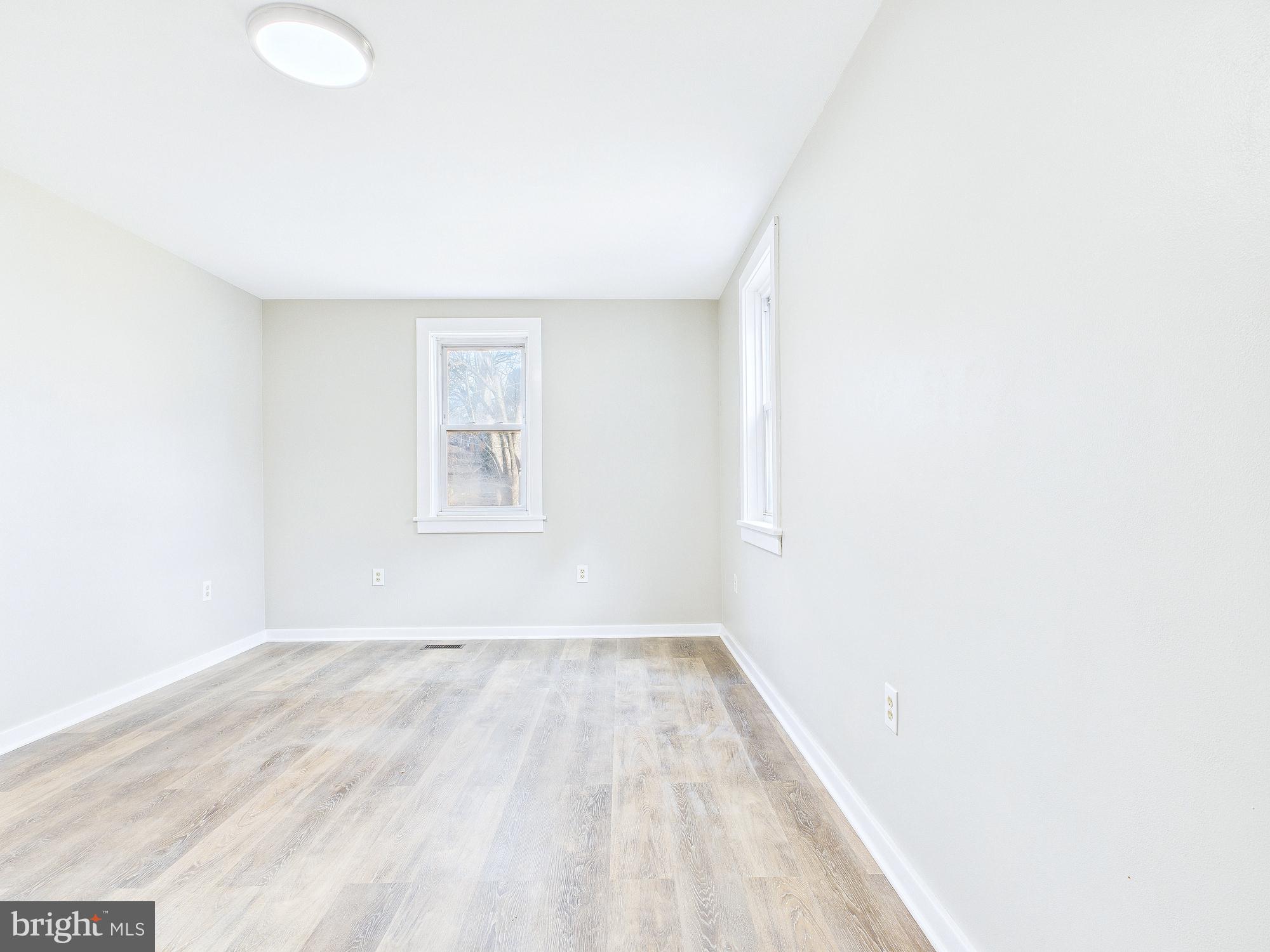312 Market Street Highspire, PA 17034 - Photo 20 of 38 a view of a big room with wooden floor and windows