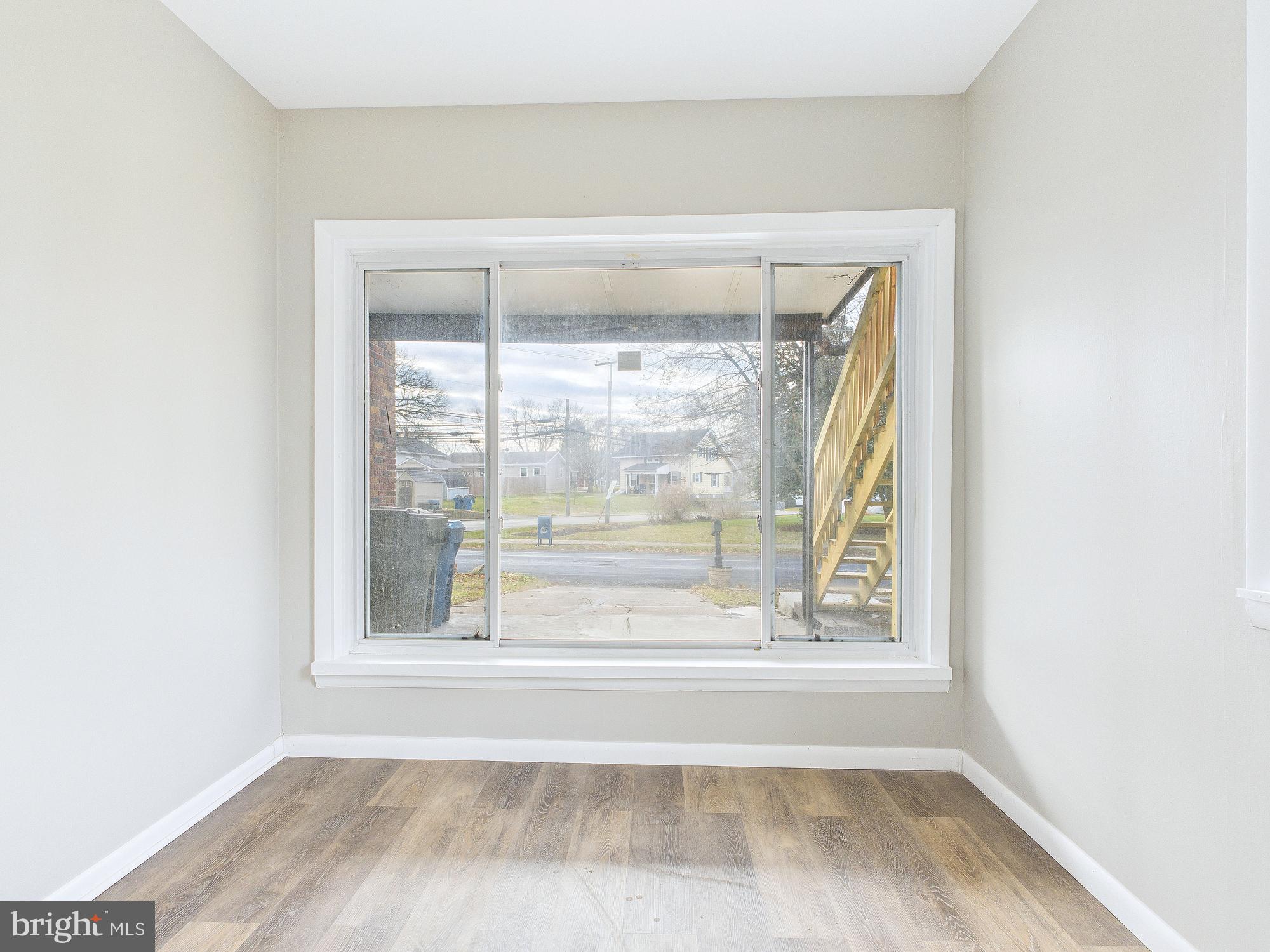 312 Market Street Highspire, PA 17034 - Photo 24 of 38 a view of a small space with wooden floor and a window