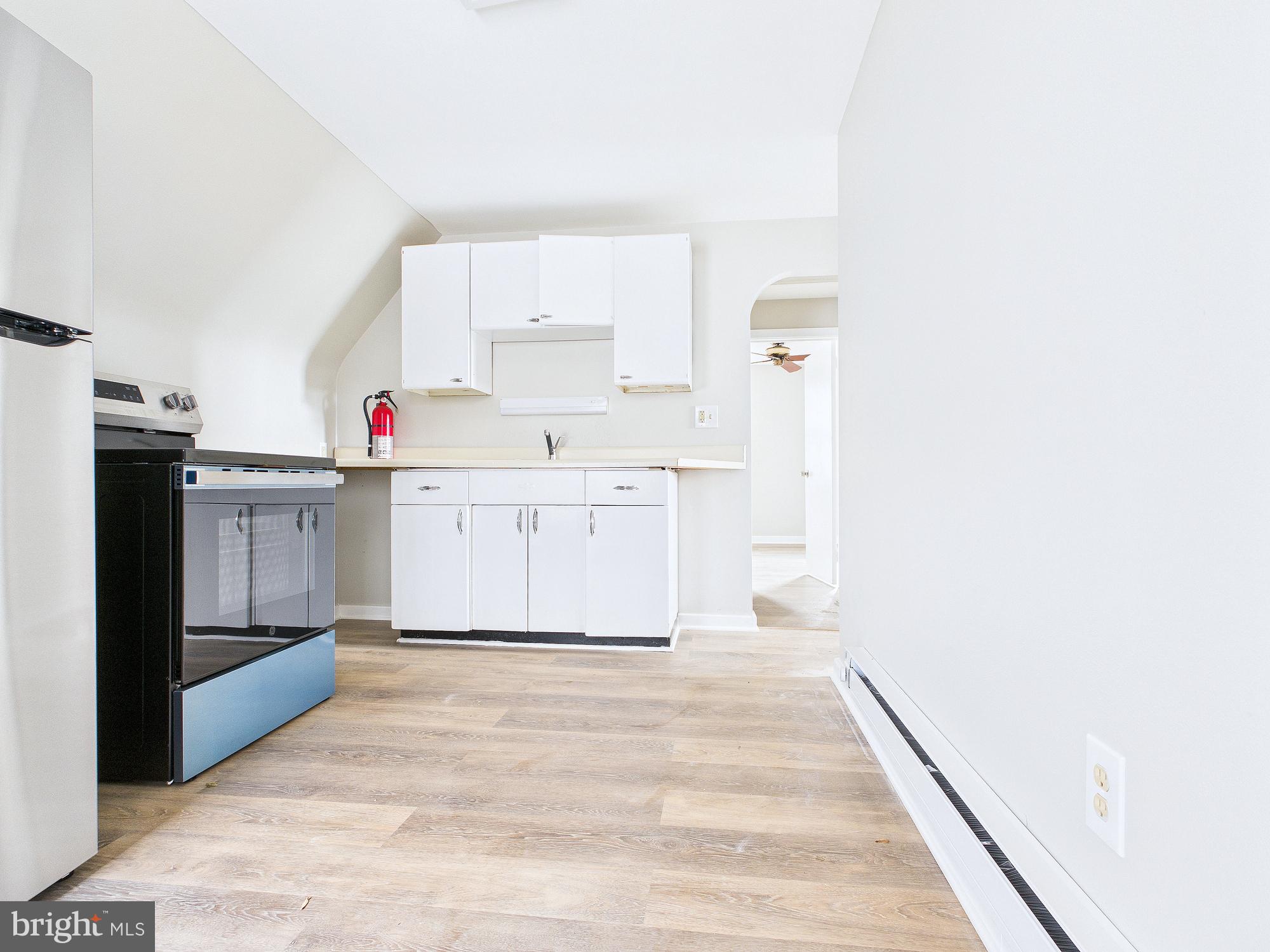 312 Market Street Highspire, PA 17034 - Photo 33 of 38 a view of a kitchen with white cabinets