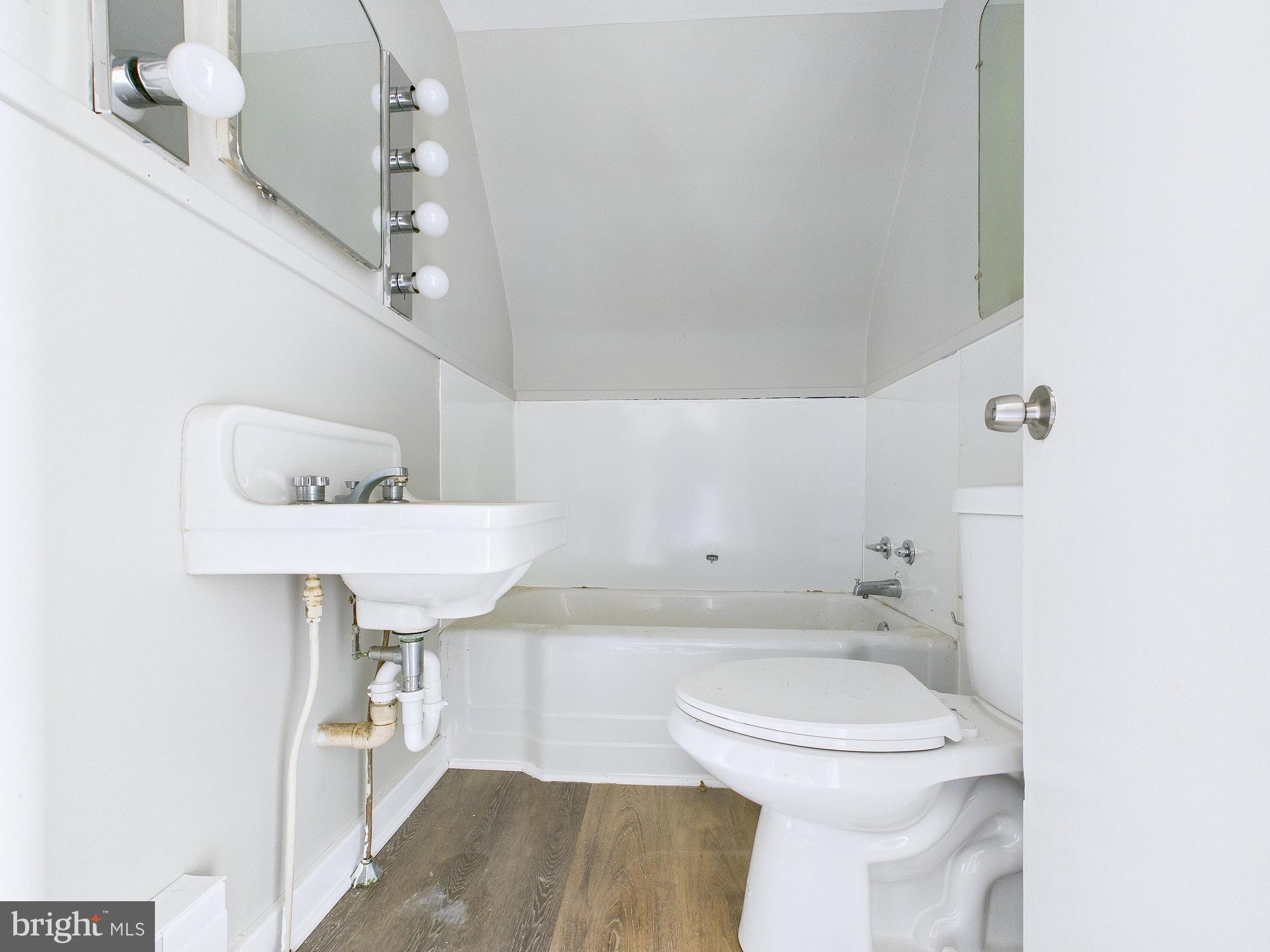 312 Market Street Highspire, PA 17034 - Photo 38 of 38 a bathroom with a sink a toilet and shower