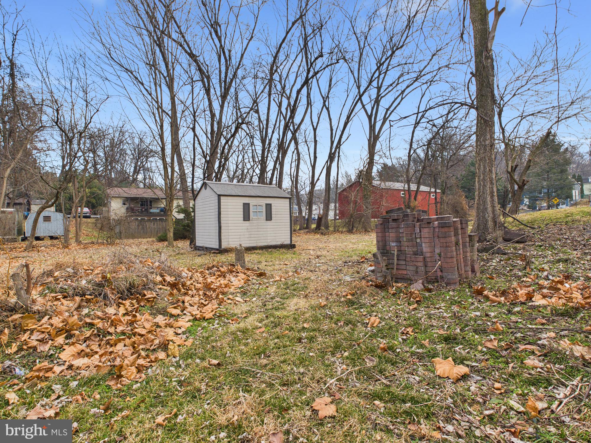312 Market Street Highspire, PA 17034 - Photo 7 of 38 a backyard of a house with large trees and outdoor space