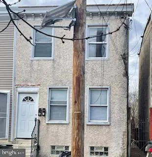 a front view of a house with a garage