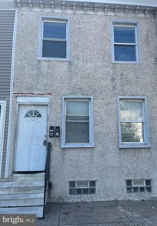 a brick house with four windows