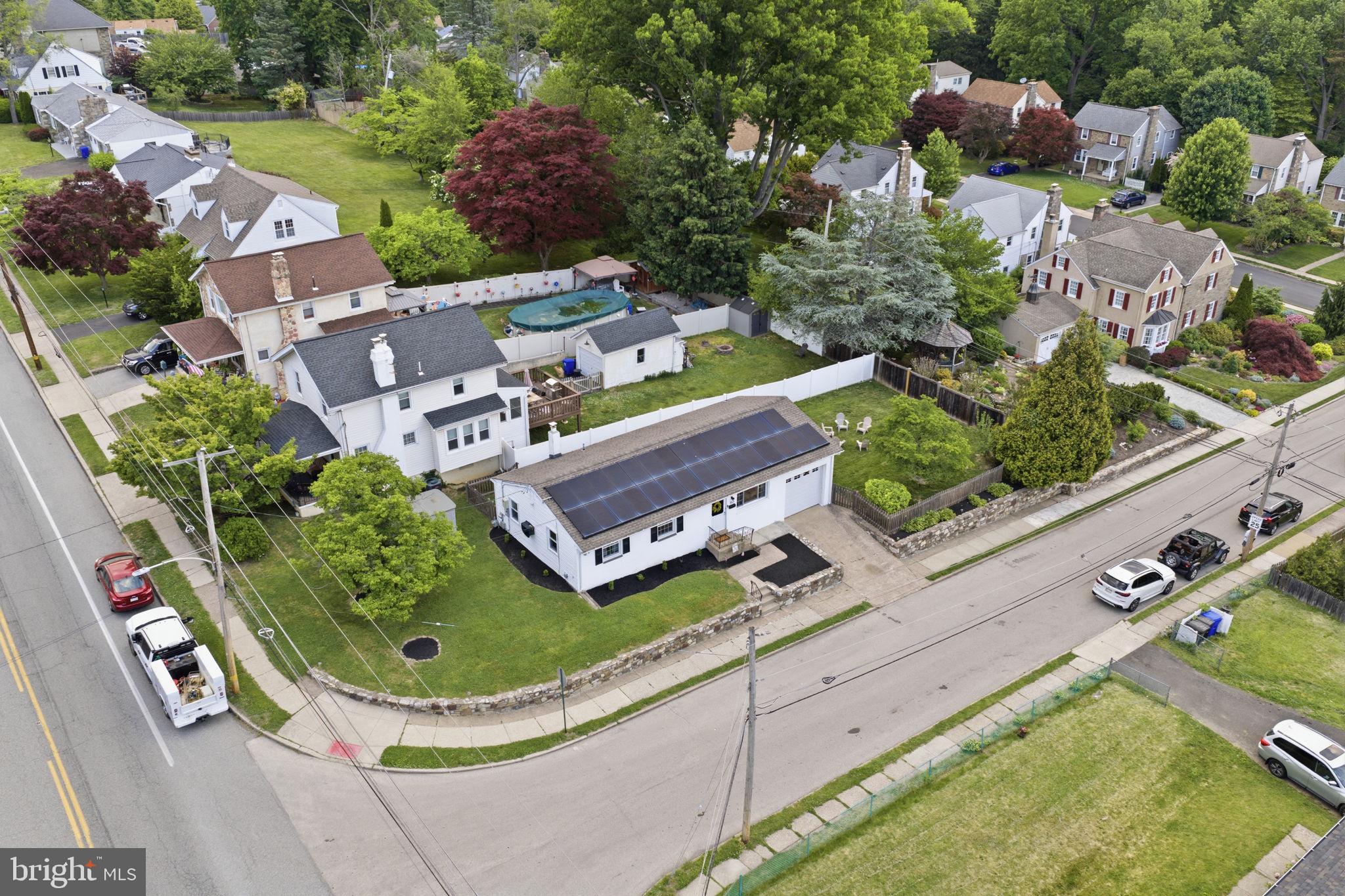 303 Radcliffe Road Glenside, PA 19038 - Photo 31 of 36 an aerial view of a house with a garden and lake view