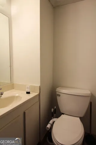 a living room with furniture and a painting