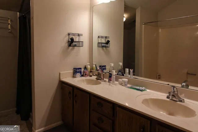 a bathroom with a sink vanity and mirror