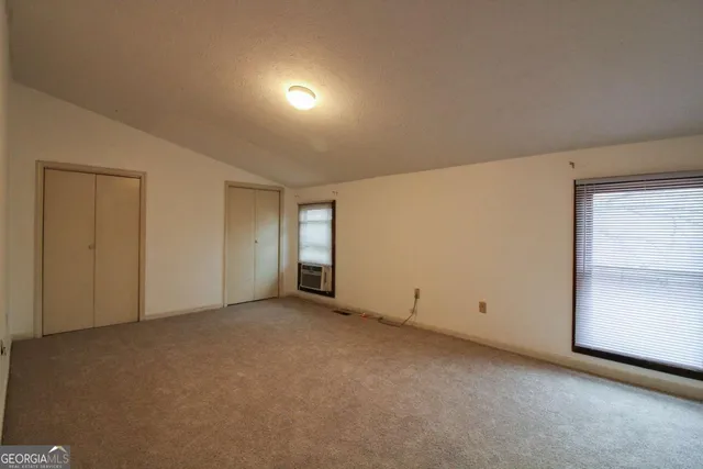 a bathroom with a shower and a tub