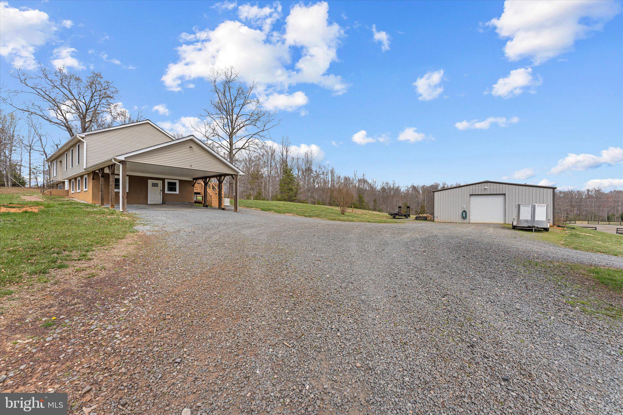 9107 Grasty Gold Mine Road Rhoadesville, VA 22542 - Photo 59 of 70 a view of a house with a yard