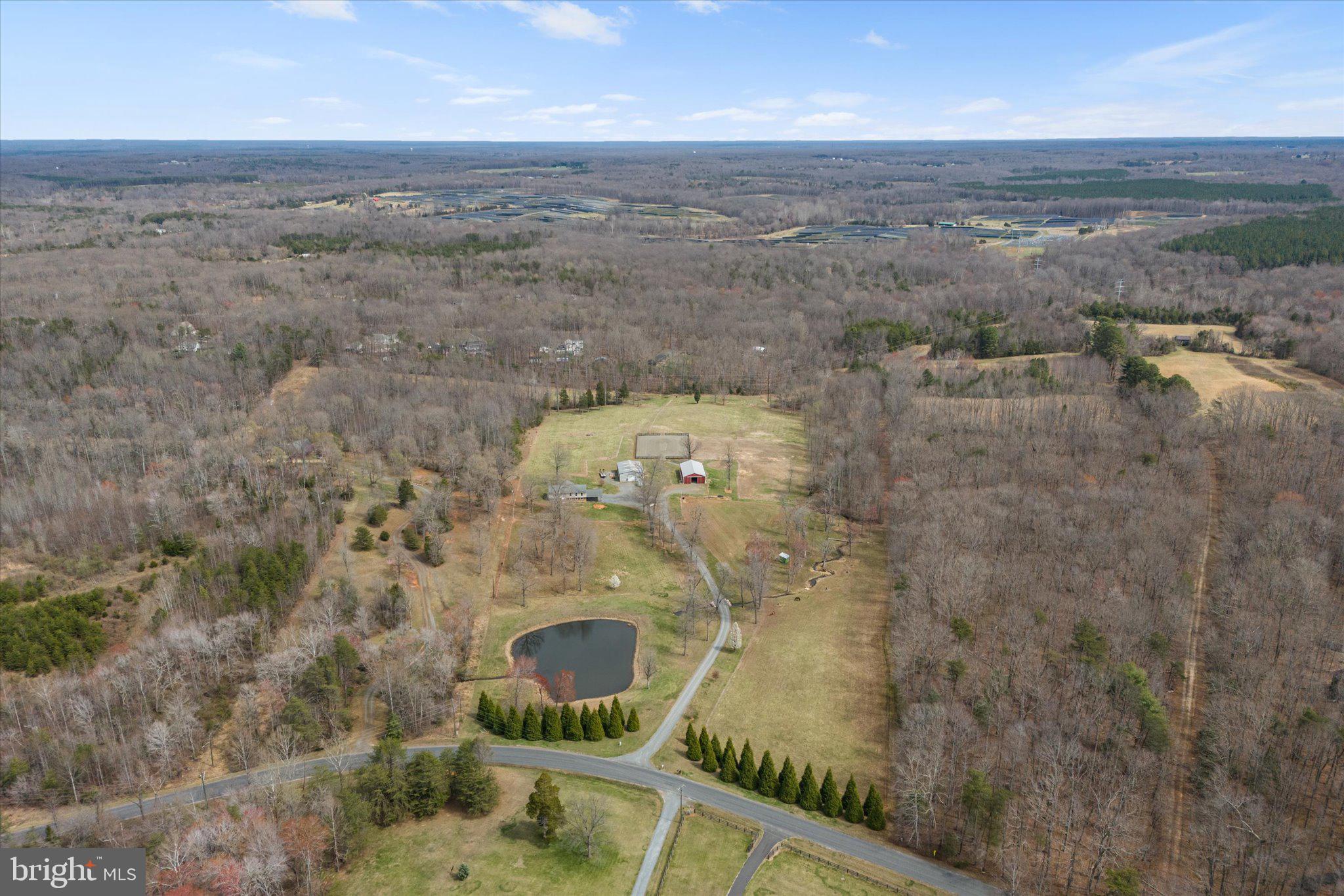9107 Grasty Gold Mine Road Rhoadesville, VA 22542 - Photo 63 of 70 a aerial view of a house with a yard