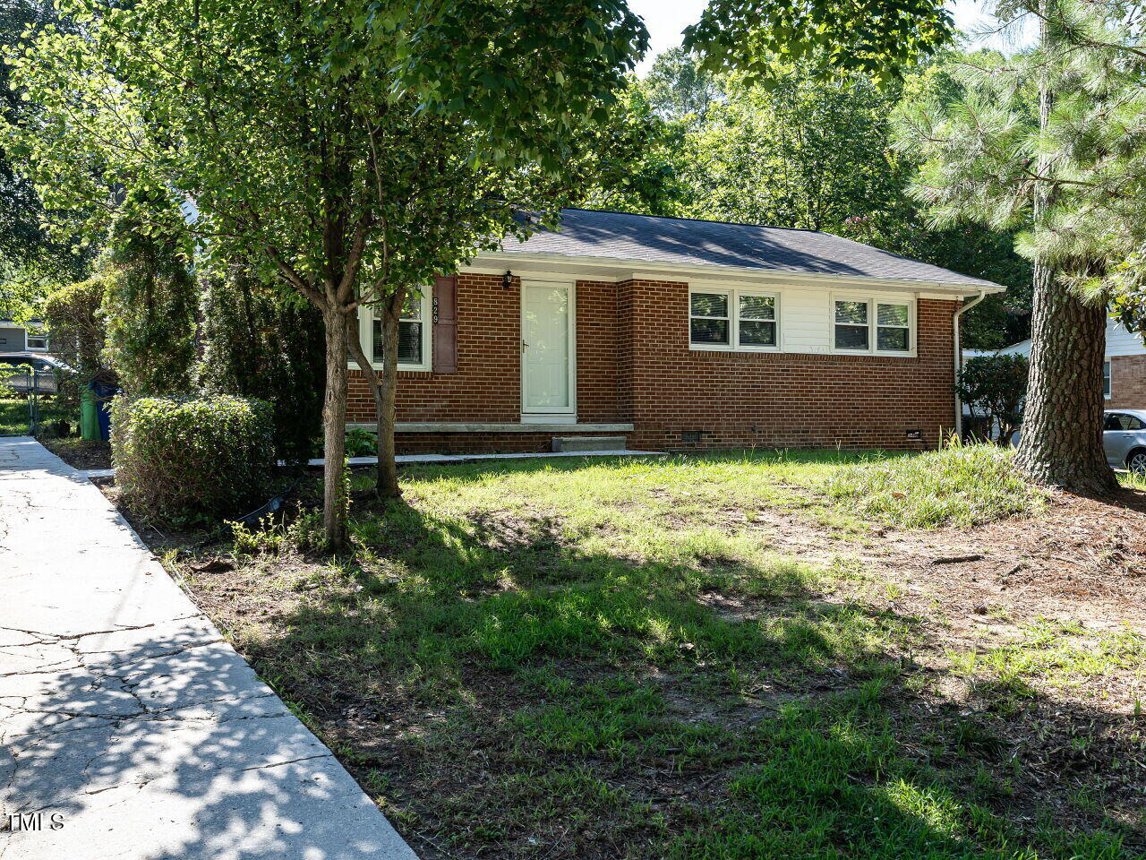 829 Greenwich Street Raleigh, NC 27610 - Photo 1 of 29 a backyard of a house with yard and outdoor seating