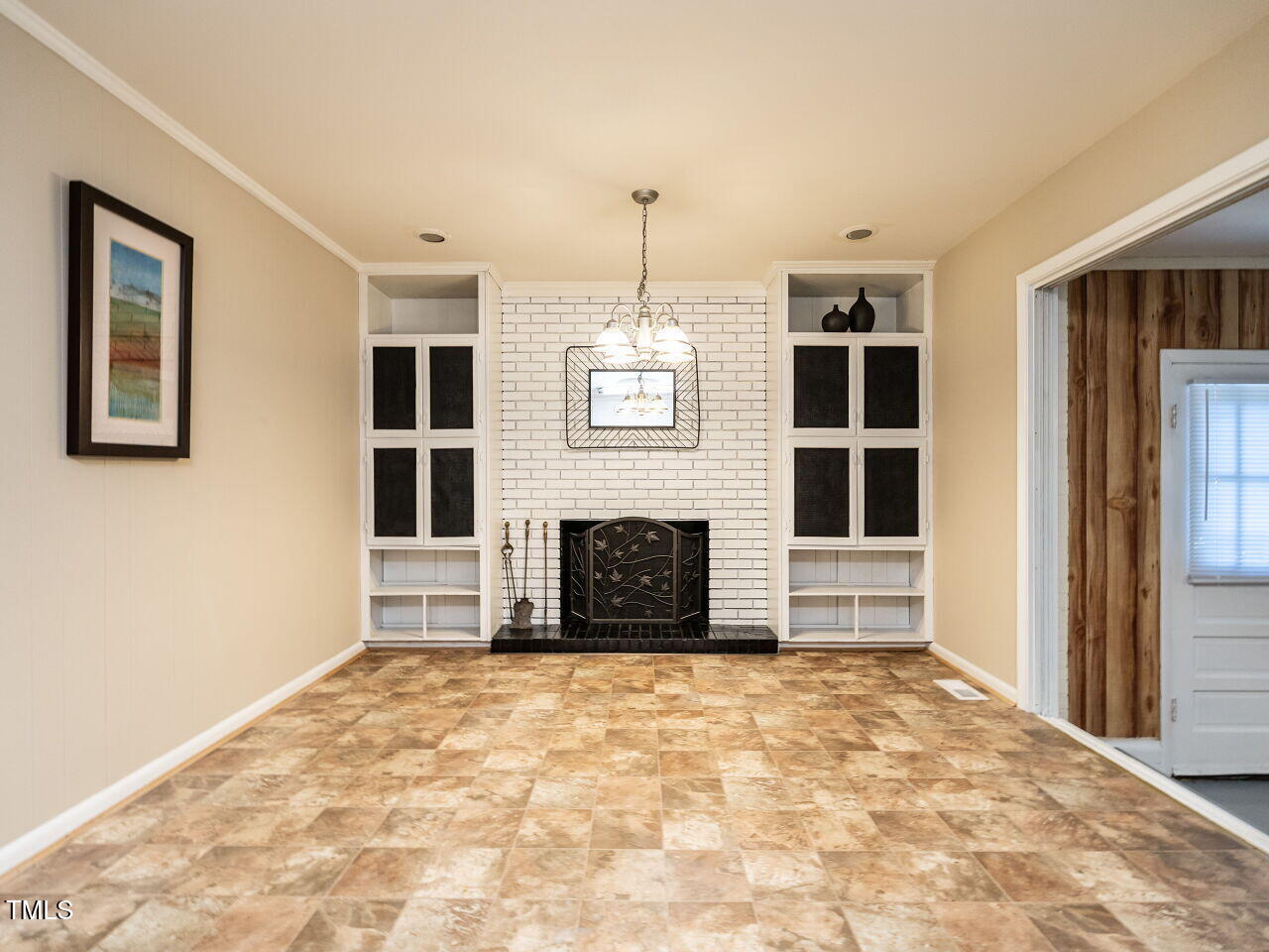 829 Greenwich Street Raleigh, NC 27610 - Photo 14 of 29 a view of a livingroom with a fireplace