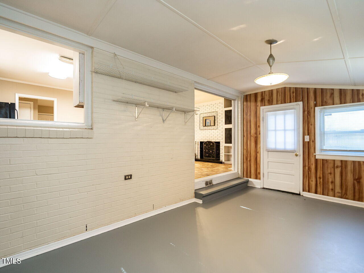 829 Greenwich Street Raleigh, NC 27610 - Photo 18 of 29 a view of a room with large windows