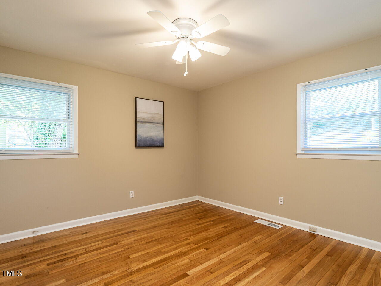 829 Greenwich Street Raleigh, NC 27610 - Photo 20 of 29 a view of a room with wooden floor and a window