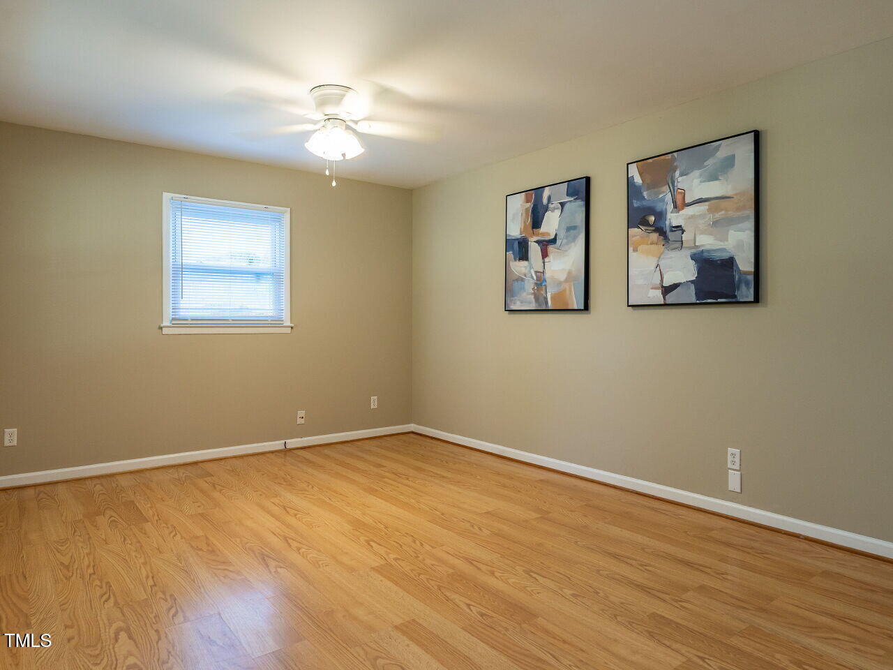 829 Greenwich Street Raleigh, NC 27610 - Photo 24 of 29 a view of an empty room with wooden floor