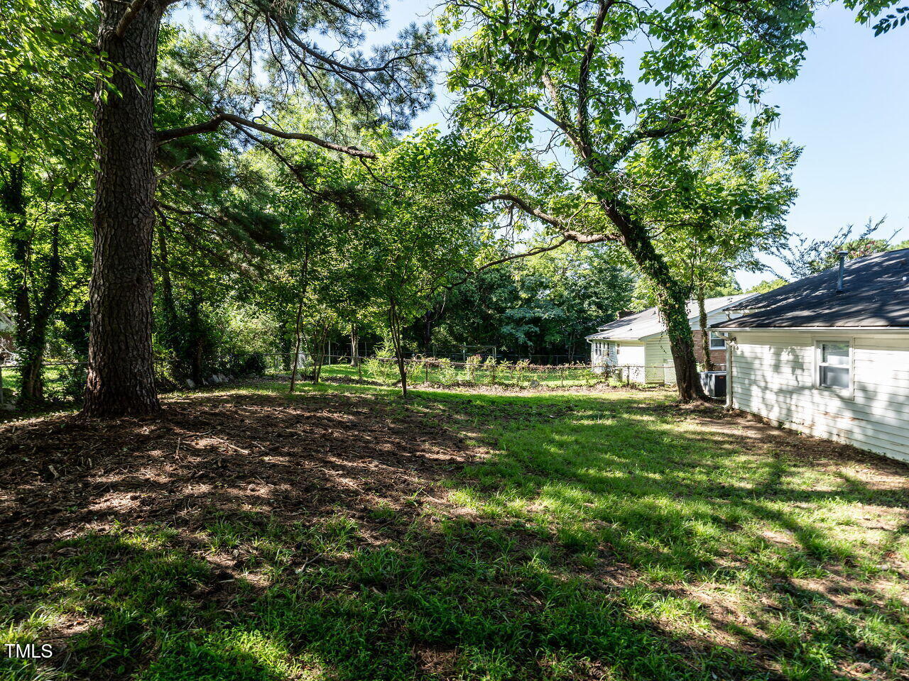 829 Greenwich Street Raleigh, NC 27610 - Photo 28 of 29 a view of a trees in a yard