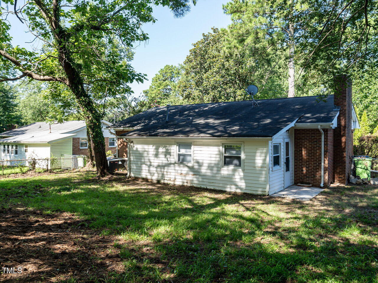 829 Greenwich Street Raleigh, NC 27610 - Photo 6 of 29 a view of a house with a yard