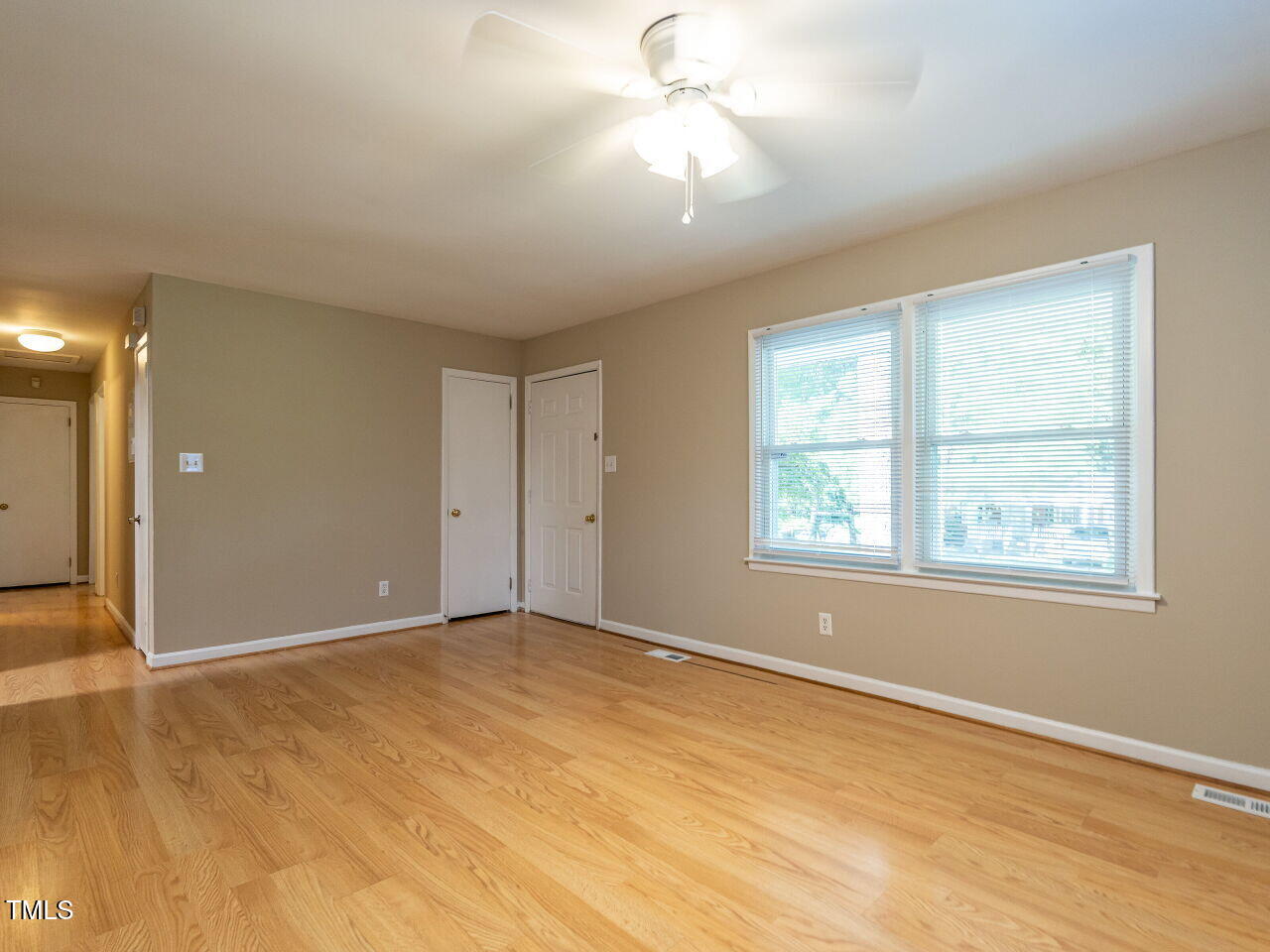 829 Greenwich Street Raleigh, NC 27610 - Photo 8 of 29 an empty room with windows and fan