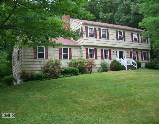 35 Paugussett Road Newtown, CT 06482 - Photo 1 of 1 a front view of a house with a garden